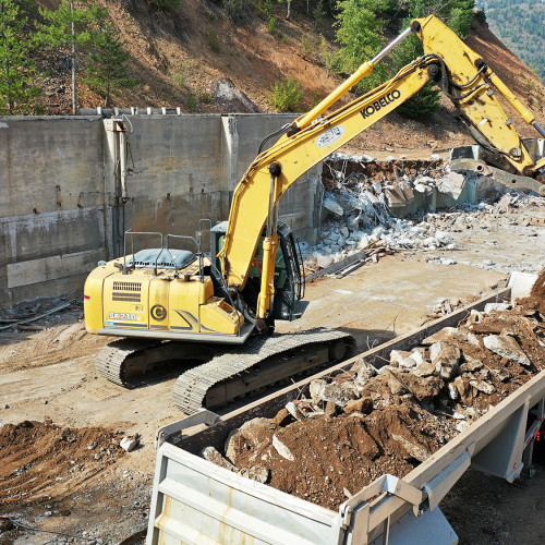 Removal of the thick concrete foundation of the old machine shop began in September of 2023.